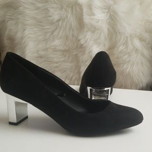 Black heeled pumps